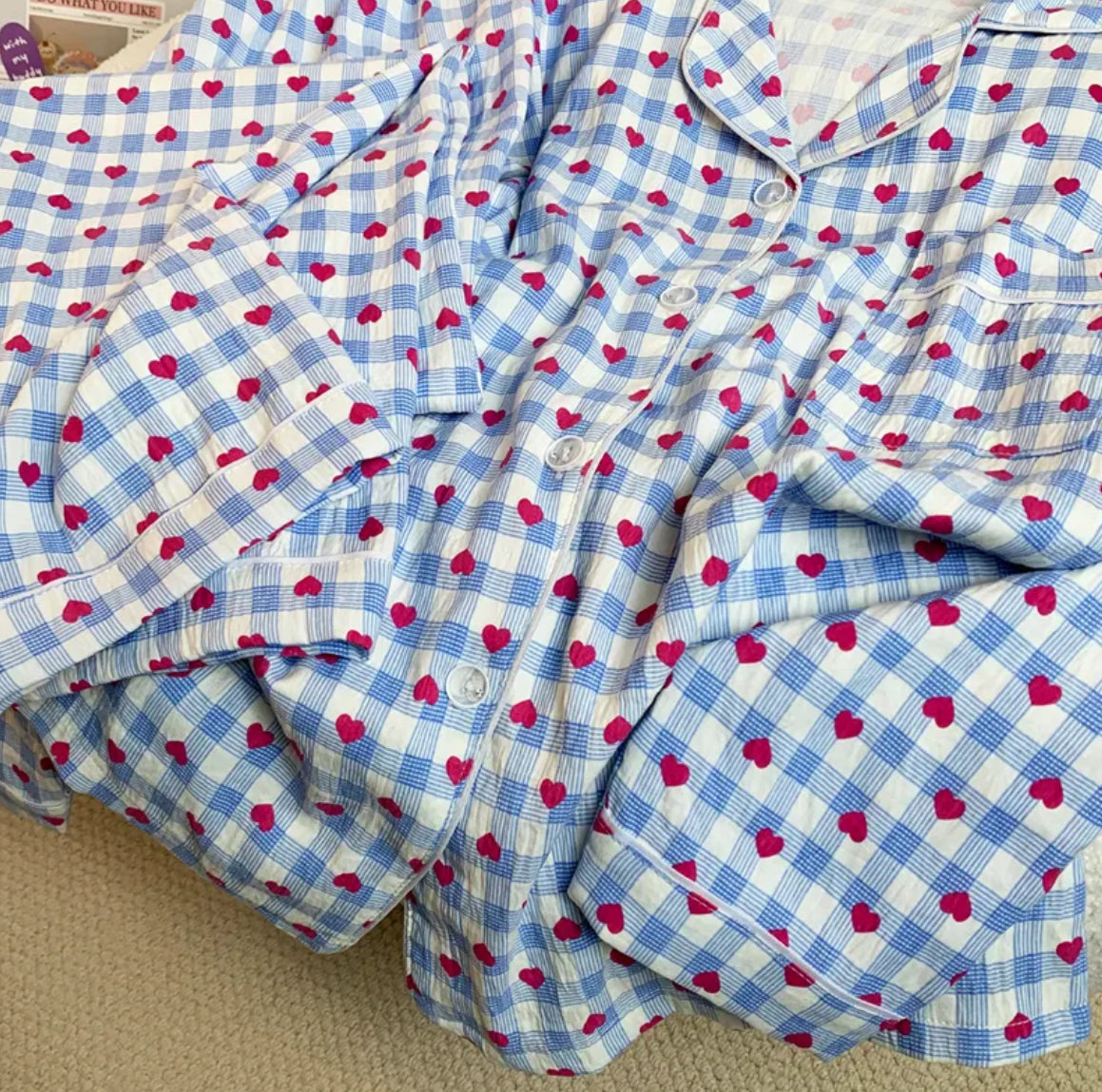Red heart on blue checked pajamas